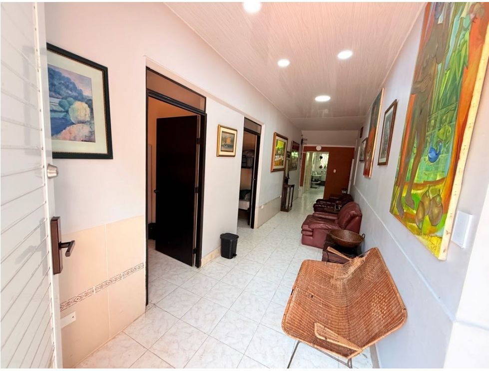 Entrance hall with seating area and artwork